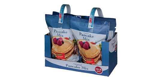 Image of pancake mix packets with carry handles applied to pairs of packets

