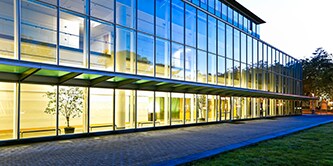 Building with tinted windows at night

