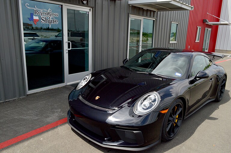 black car covered with 3M paint protection film

