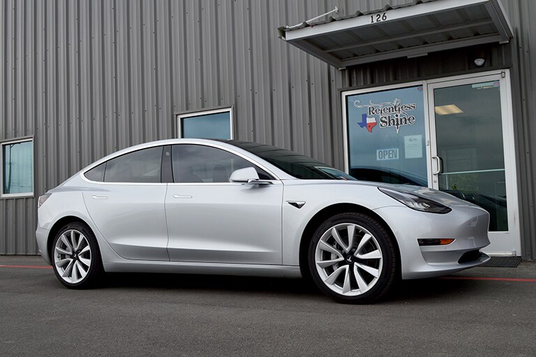 white car covered with 3M paint protection film
