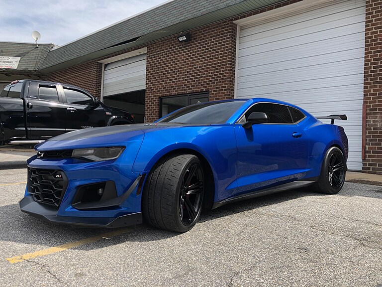 blue car tailight view with 3M paint protection film
