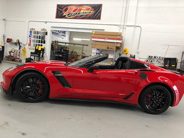 red car covered with 3M paint protection film
