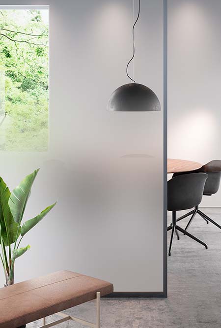 Image of an office showing a conference table obscured by a glass panel covered in FASARA Mist-S
