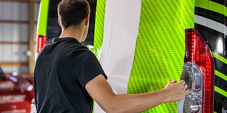 Installer holding IJ280 film panel
