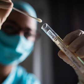 Medical professional performing a covid-19 test
