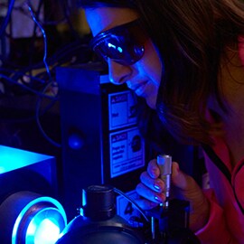 An image of a person working in an optical 3M laboratory.