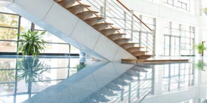 clean floors shining in a commercial space with a stairwell.