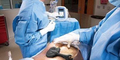 Clinician with a patient using respiratory protection
