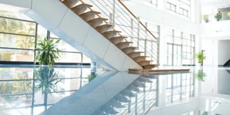 Bright and shiny office staircase with polished floors.
