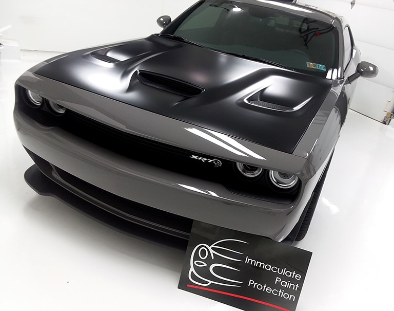 black car covered with 3M paint protection film
