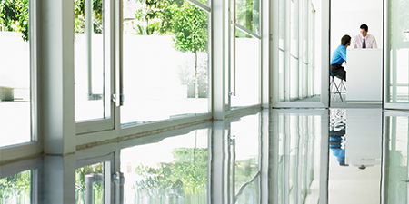 Shiny floor with a 3M floor protector applied.
