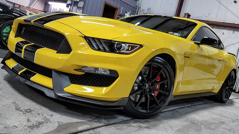 yellow car covered with 3M paint protection film
