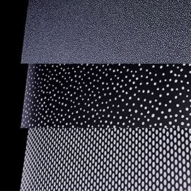 Image chowing close up of FASARA sand, pop and oval patterns on a black background