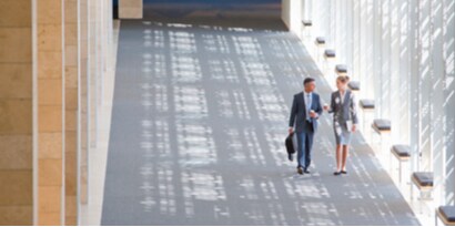 birds eye view of a commercial building's hallway with clean carpet.
