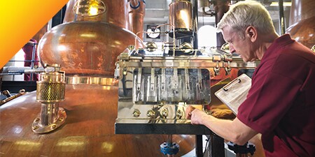 Taps of spirits at a distillery.
