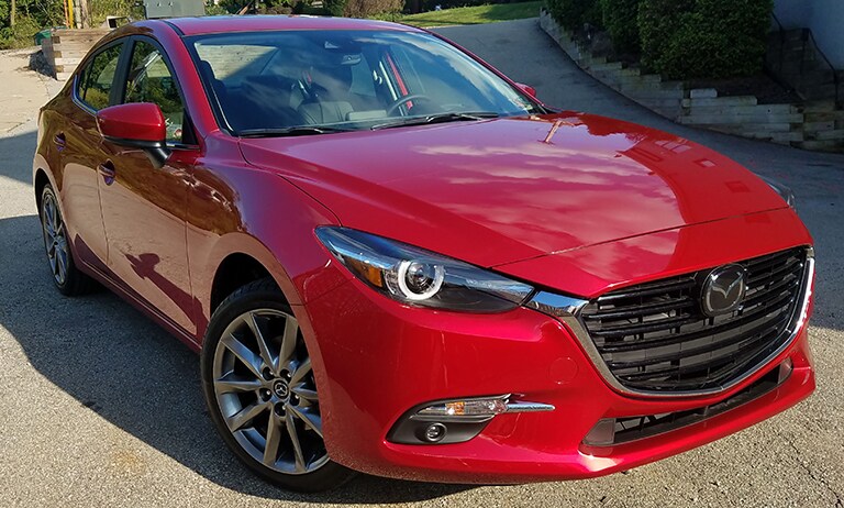 red car covered with 3M paint protection film
