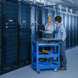 Data center engineers with server racks