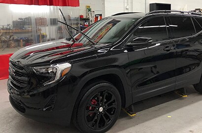 black car covered with 3M paint protection film
