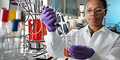 woman performing science lab test
