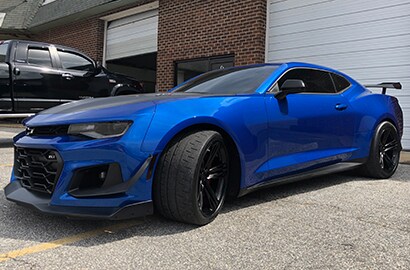 blue car tailight view with 3M paint protection film