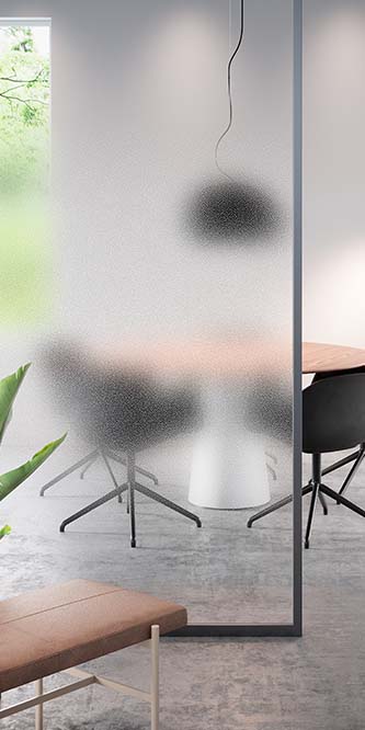 Image of an office showing a conference table obscured by a glass panel covered in FASARA Pop-W
