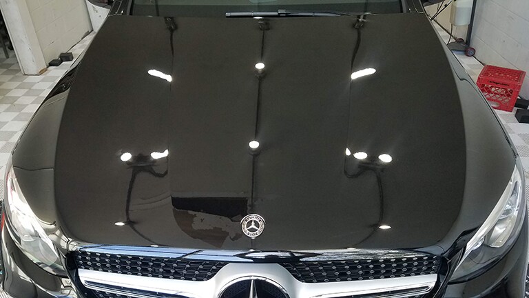 black car covered with 3M paint protection film
