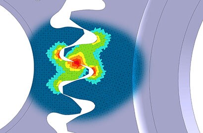 Image of finite element modeling showing stress points on interacting gearwheels