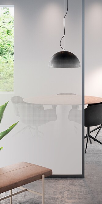 Image of an office showing a conference table obscured by a glass panel covered in FASARA Illumina Seamless-PR
