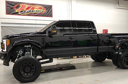 black car covered with 3M paint protection film