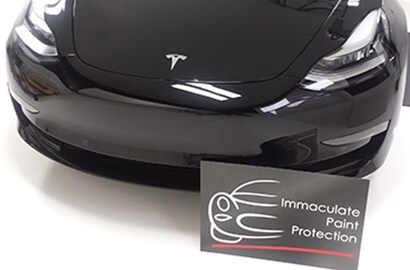 black car covered with 3M paint protection film
