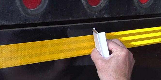 Applying conspicuity tape on a vehicle
