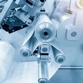 Close-up of the roller production machine