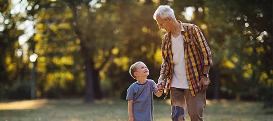 Patient using PREVENA™ Therapy walking with child
